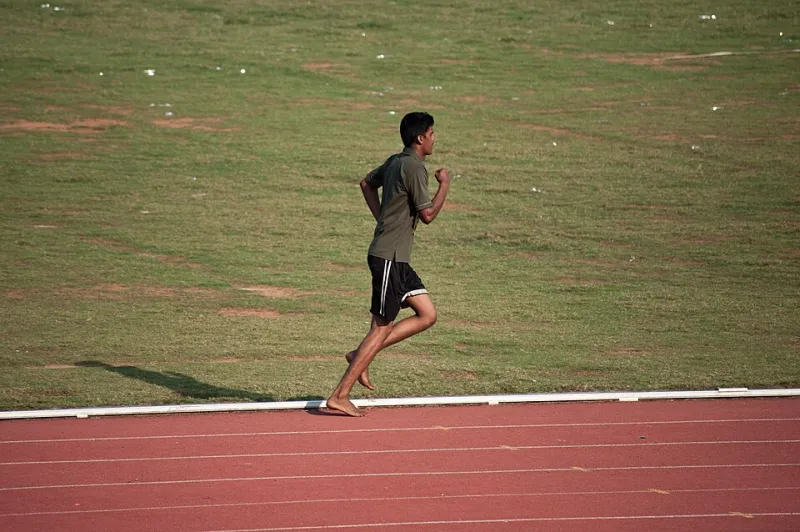 Shoes Off, Performance Up? What Going Barefoot on the Sand Really Does to Your Body